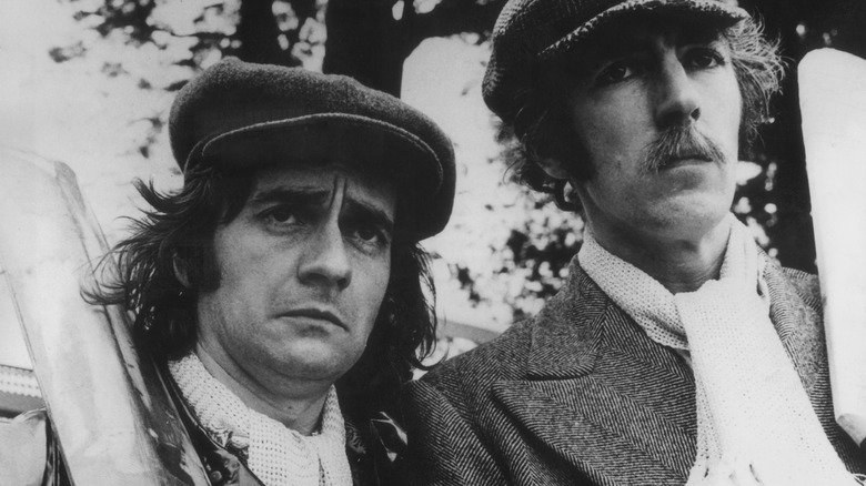 Dudley Moore flatcap with Peter Cook cricket bats