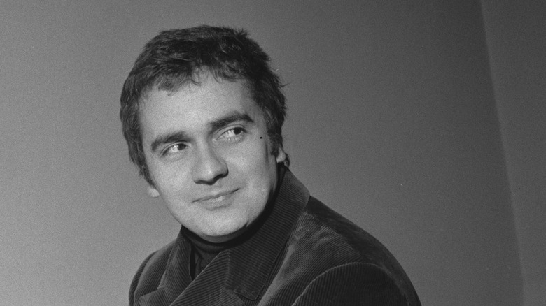 Dudley Moore corduroy jacket smiling looking over shoulder