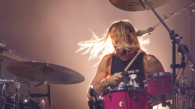 Taylor Hawkins drums onstage performing