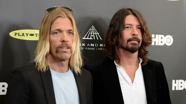 Taylor Hawkins Dave Grohl suits at event