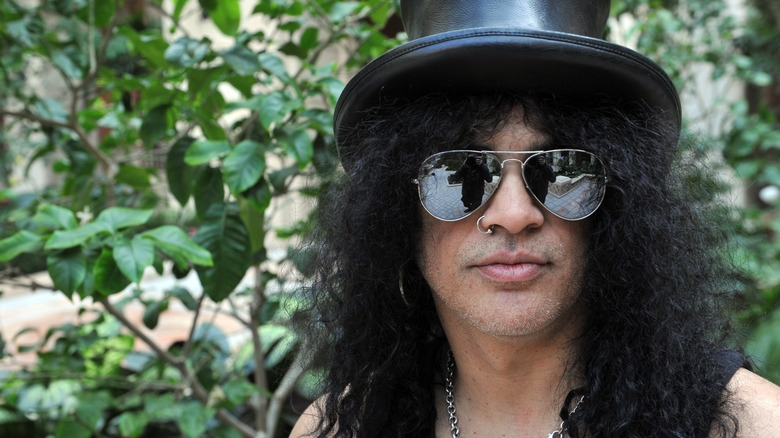 The Tragic Life Of Rock Star Guns N' Roses Guitarist Slash Explained