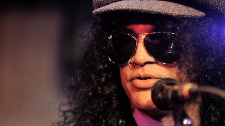 Slash sunglasses hat speaking mic