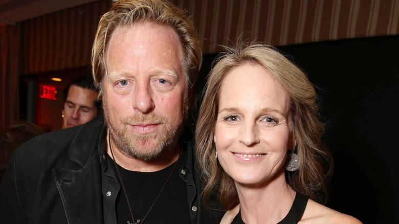 matthew carnahan embracing helen hunt smiling at camera