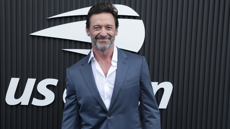 Hugh Jackman suit smiling at event