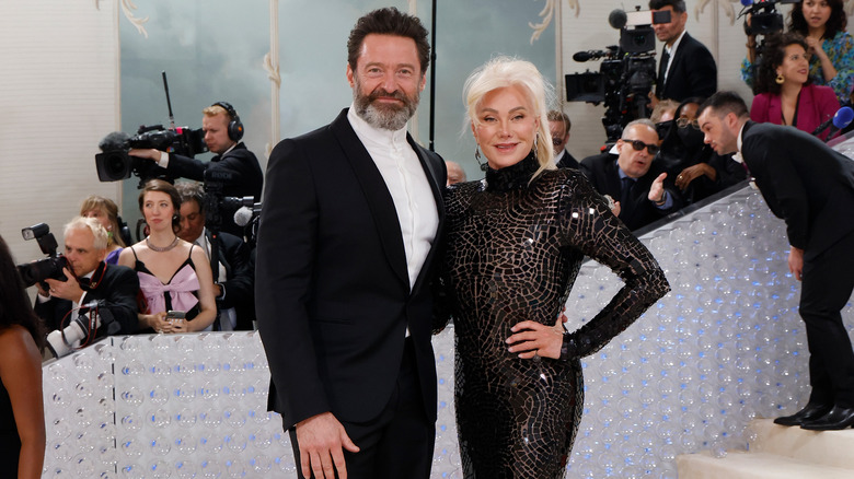 Hugh Jackman beard black suit Deborra-Lee Furness at event