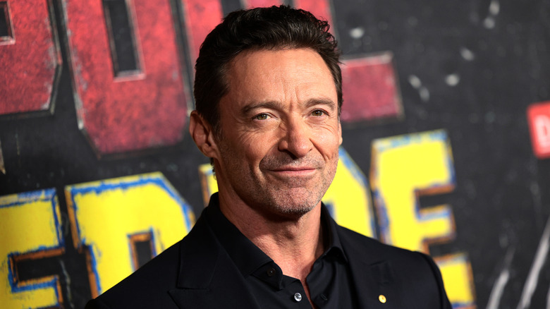 Hugh Jackman black shirt smiling Deadpool & Wolverine premiere