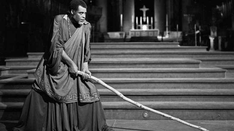 James Earl Jones on stage holding stick