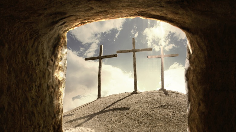 Three crosses on hill backlit