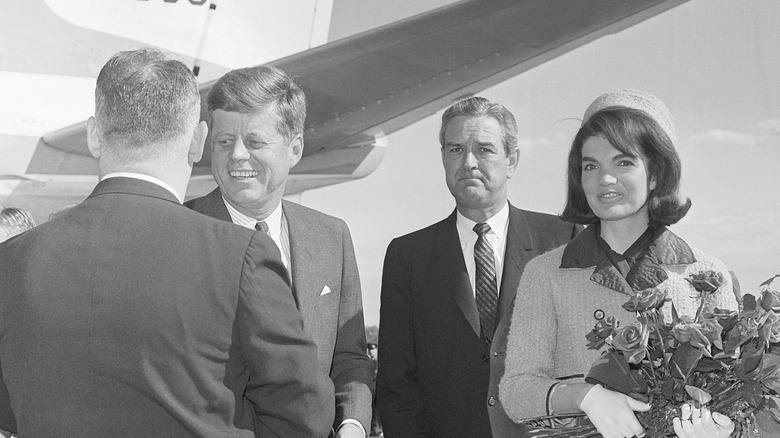 John and Jackie Kennedy at the airport in Dallas before the assassination