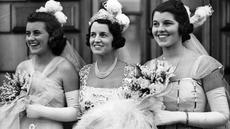 Kathleen, Rose, and Rosemary Kennedy in formal dresses