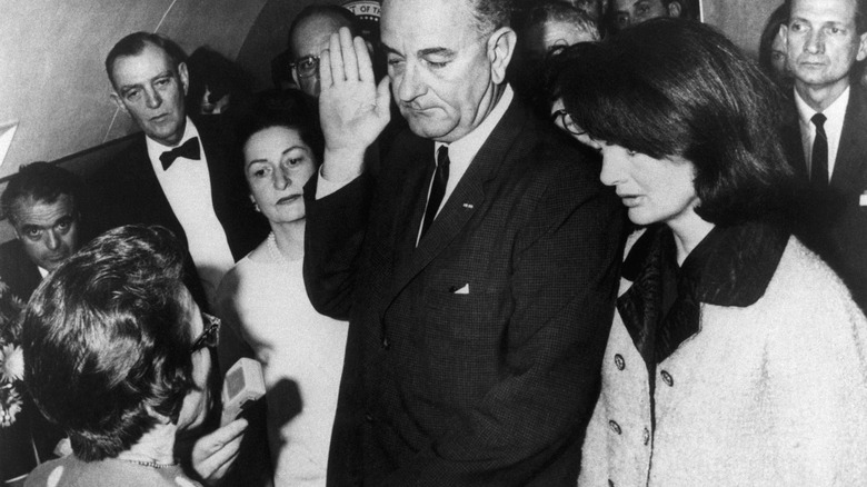 Jackie Kennedy with Lyndon B. Johnson being sworn in as president