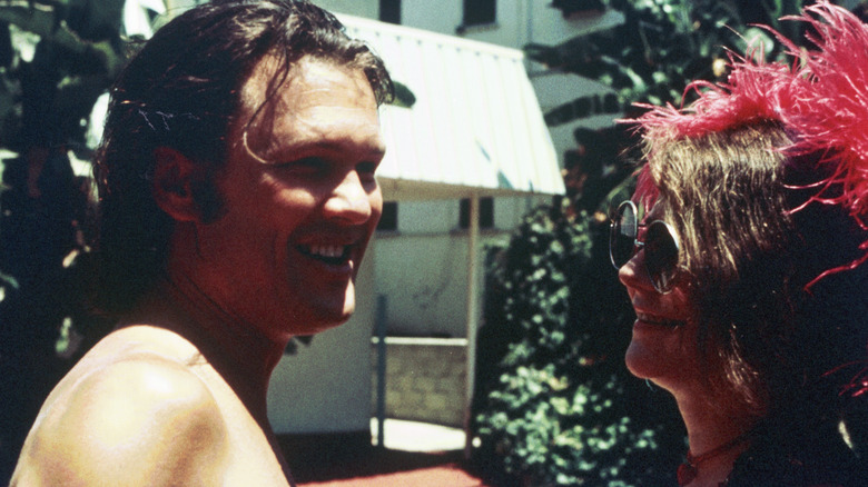 Kris Kristofferson smiling with Janis Joplin