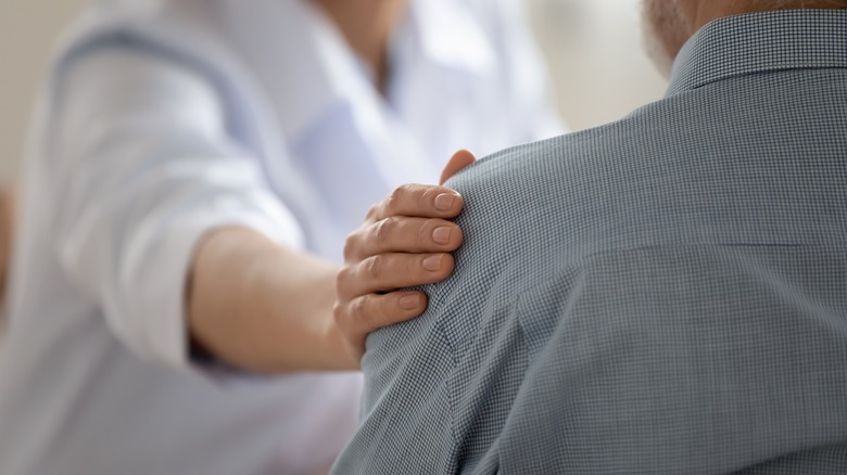 doctor comforting patient 