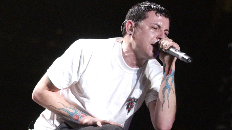 Chester Bennington with black hair singing