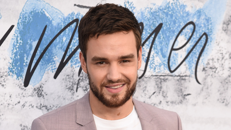 liam payne head tilted beard smiling