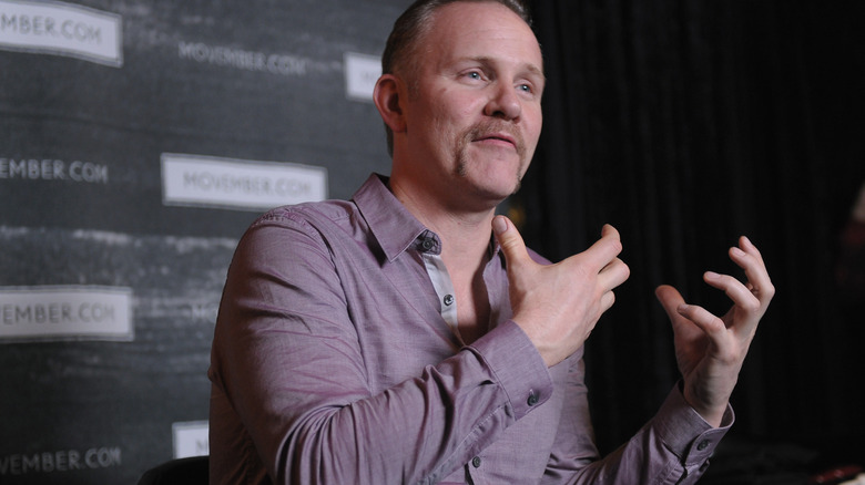 Morgan Spurlock gesturing during an interview