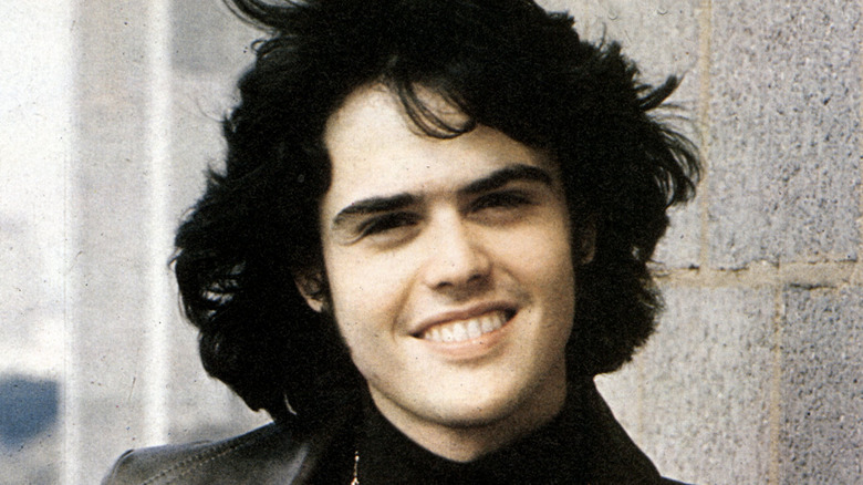 donny osmond smiling with long hair in 70s publicity still