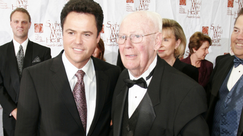 donny osmond and george osmond at awards gala in tuxedos