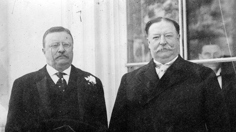 Theodore Roosevelt stands with William Taft