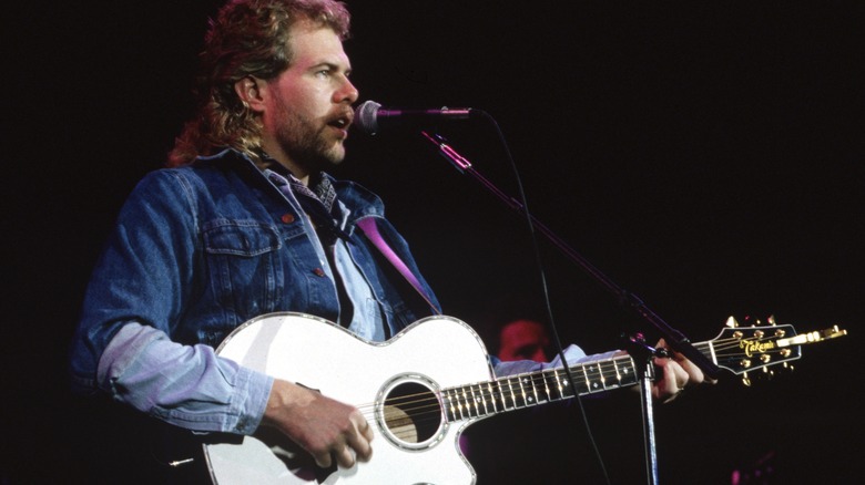 Toby Keith mullet performing white guitar