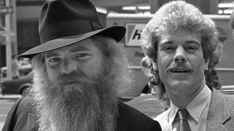 Suited zz top dusty hill with hat frank beard outside