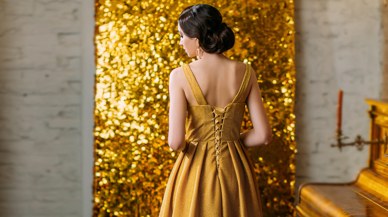 woman gold dress