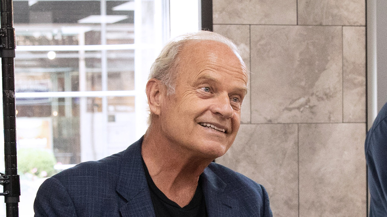 Kelsey Grammer looks up smiling