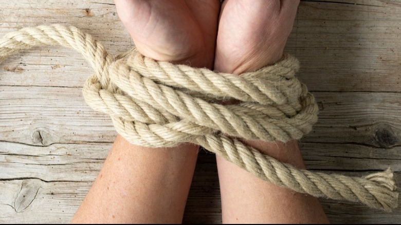 hands tied with rope