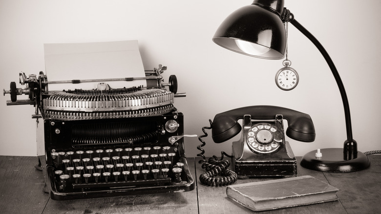 Old-fashioned typewriter and telephone 