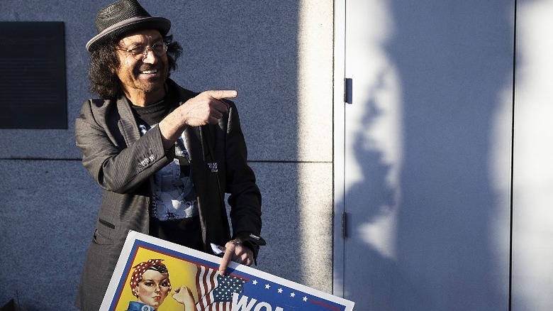 Vincent Fusca pointing, holding sign