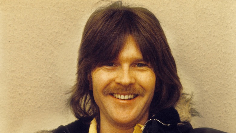 Young Randy Meisner smiling with moustache