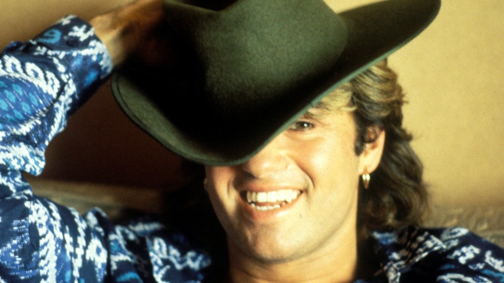 George Michael smiling in a close-up shot