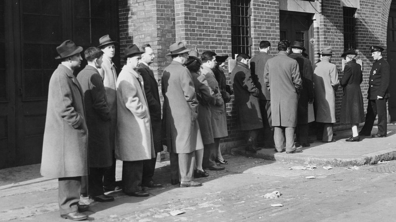 People waiting on line to identify bodies