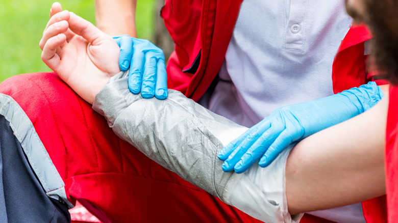 Medic treating an arm burn