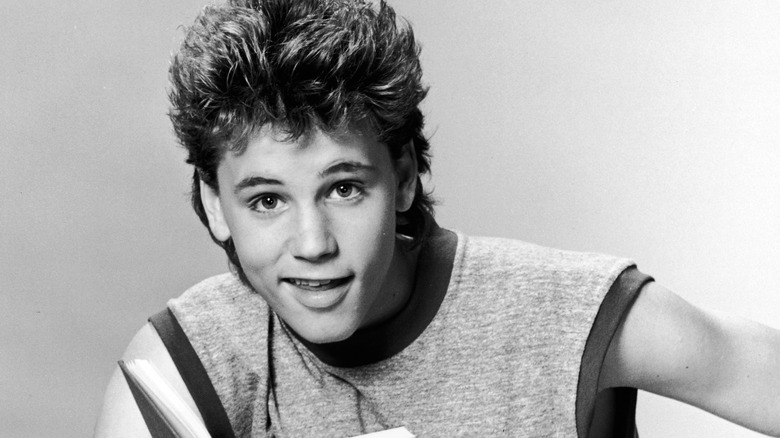 Young Corey Haim posing for camera