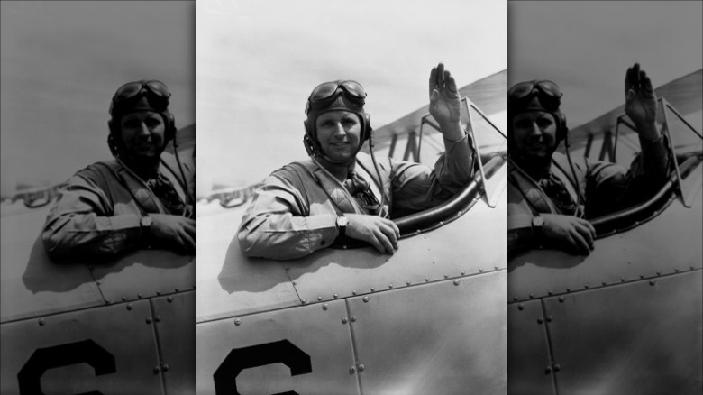 Joseph Kennedy Jr. waving airplane cockpit