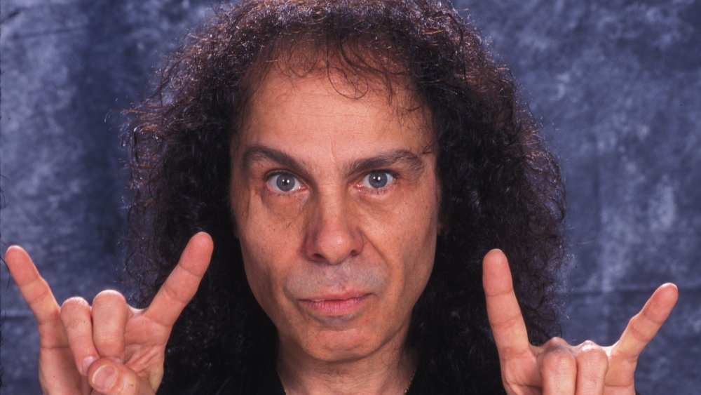 Ronnie James Dio giving the devil horns in a photo shoot.