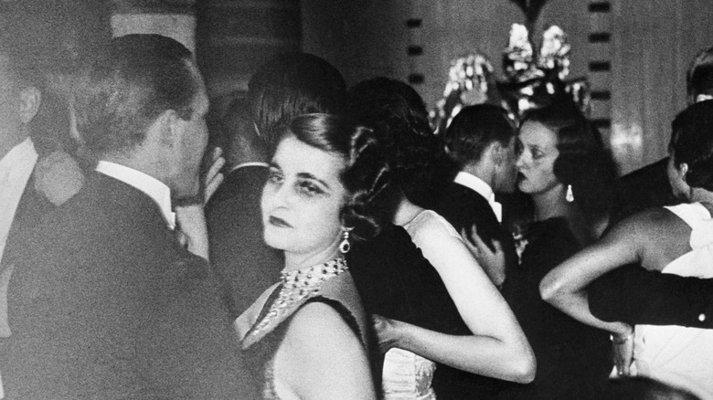 Barbara Hutton dancing at a party looking unhappy