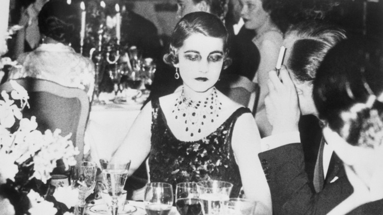 Barbara Hutton looking sad at a party