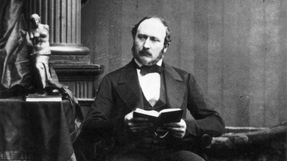 Prince Albert holds a book