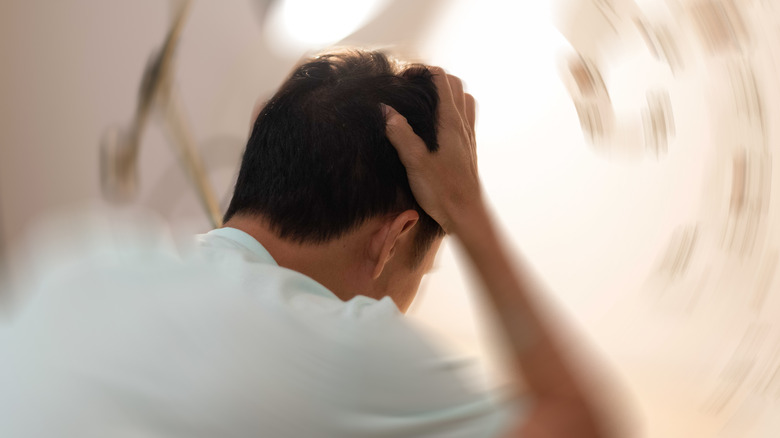 Young man suffering from headache