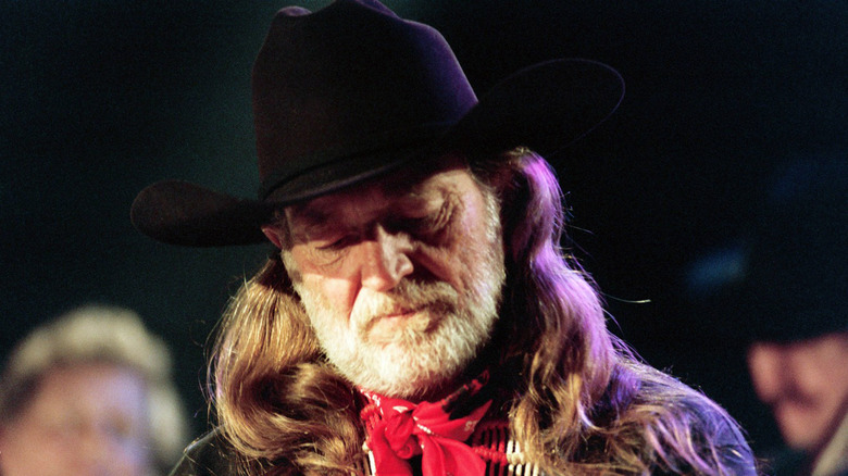 Willie Nelson looking downward