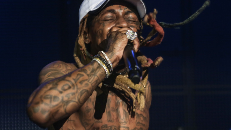 Lil Wayne performs shirtless