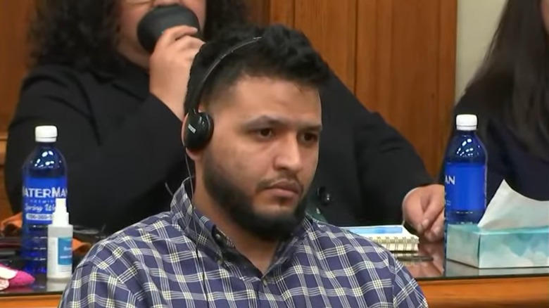 Jose Ibarra in court wearing headphones