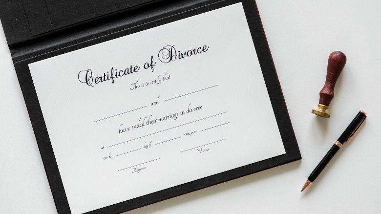 Divorce certificate, stamp, and pen