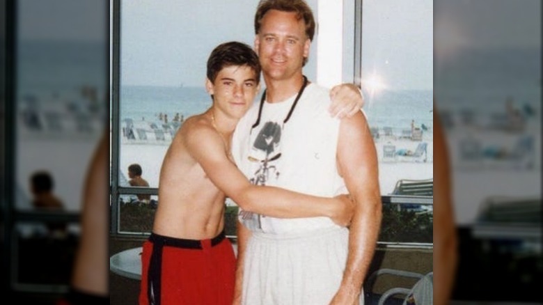 Ryan hugging his father, Jay Poston