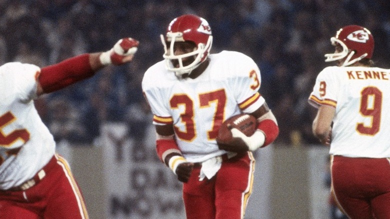 Joe Delaney running football