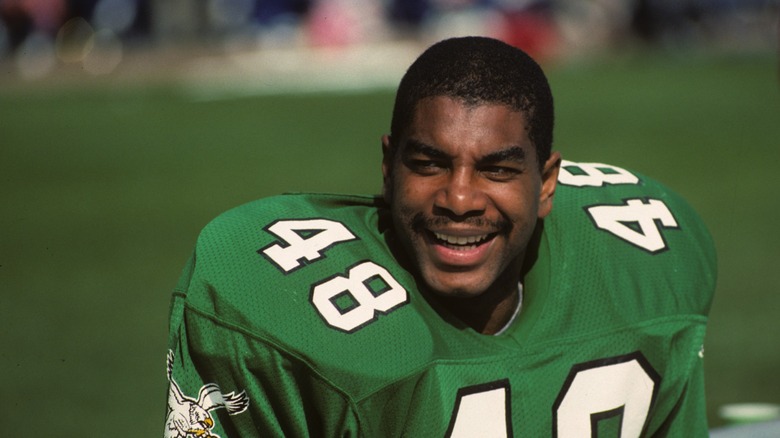 Wes Hopkins smiles on the sidelines