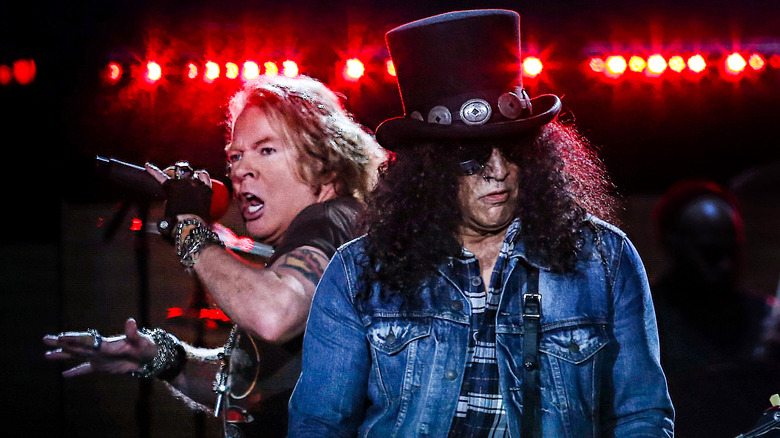 Axl Rose and Slash performing together red lights