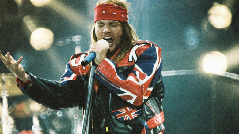 Axl Rose red bandana performing on stage